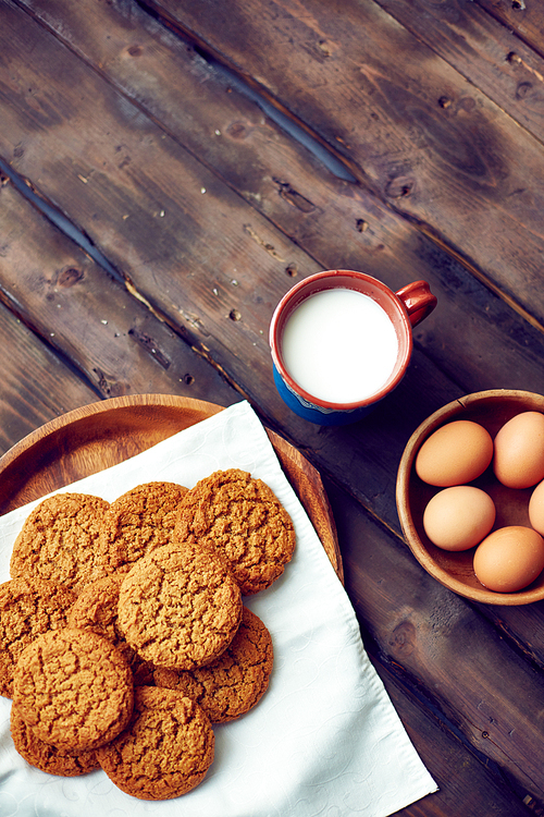 Gingersnaps with eggs and cup of milk