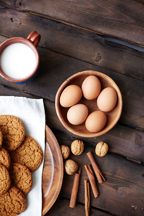 High angle view of eggs, cookies and milk