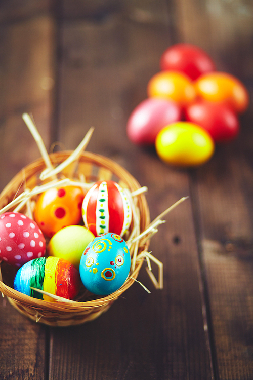 Easter painted eggs in small basket