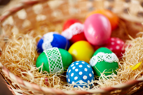 Multicolored Easter eggs in a basket