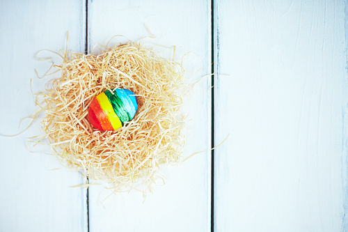 Striped Easter egg in nest