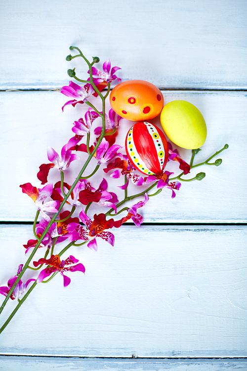 Easter painted eggs with purple orchids