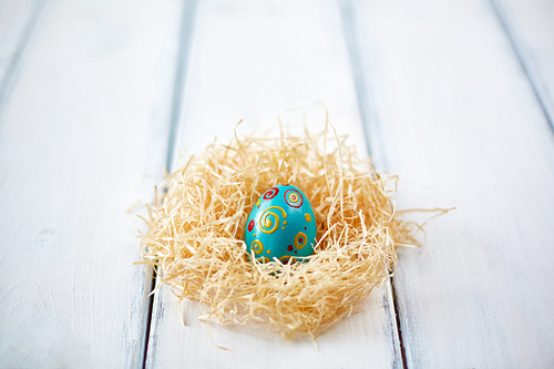 Ornate Easter egg in straw