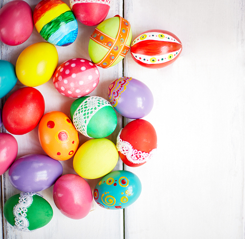 Creatively painted Easter eggs on white background