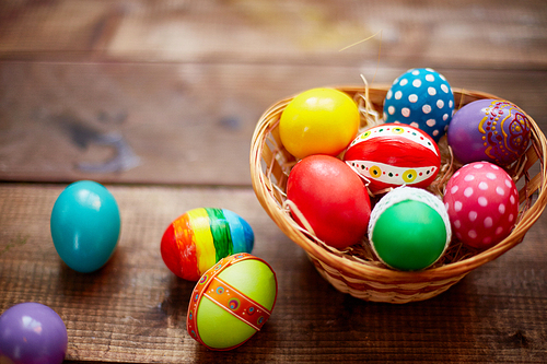 Creative Easter symbols of various colors in basket