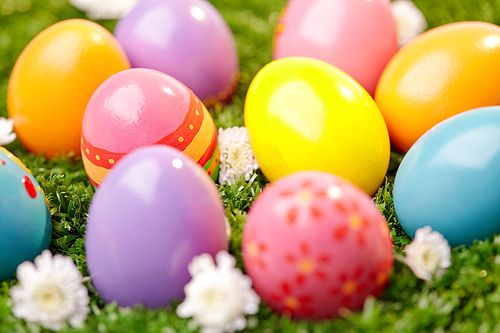 Colorful Easter eggs on grass