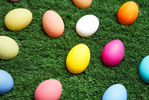 Coloured Easter eggs in green grass