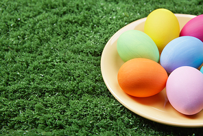 Close-up of coloured Easter eggs on plate