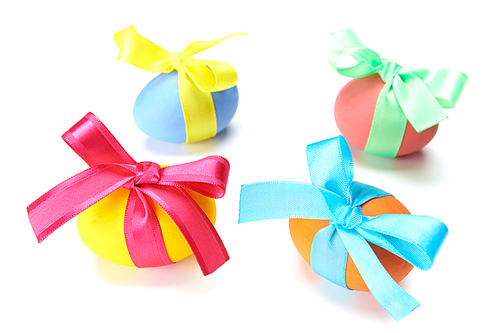 Group of Easter eggs tied up by silk ribbons