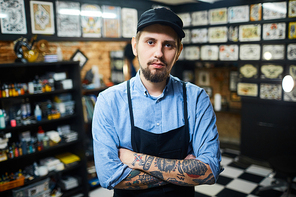 Master of tattoo art in his salon