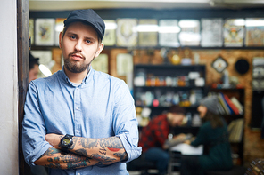 Self-employed tattoo master in his salon