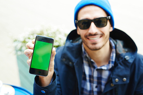 Smartphone held by modern traveler