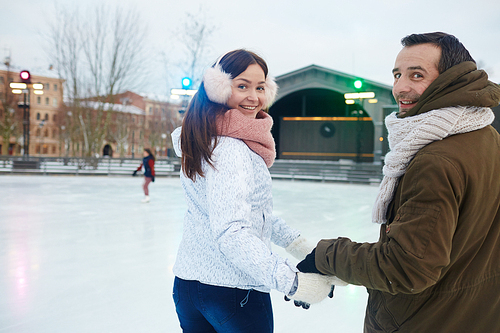 Young amorous couple skating at leisure