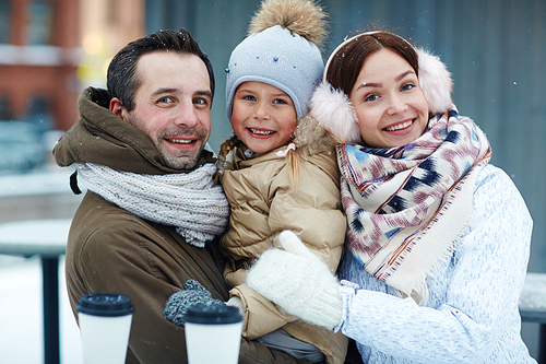 Healthy family of three in winterwear 