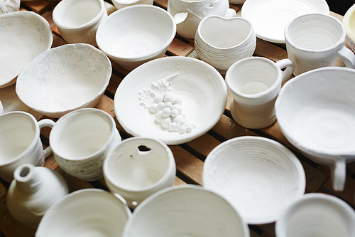 Collection of white earthenware in potter workshop