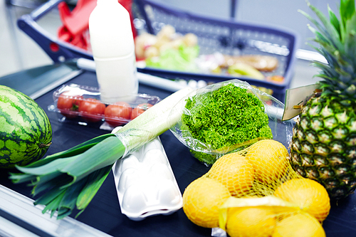 Group of healthy food products on supermarket checkout