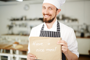 Handsome chef  with smile in cafe