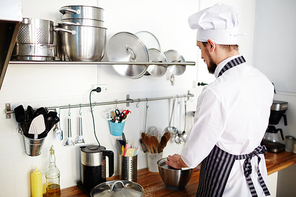 Busy baker cooking tasty food at workplace