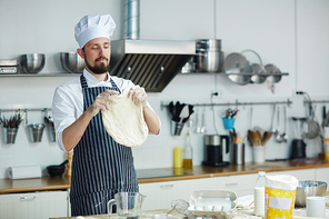 Chef with flatbread cooking at workplace