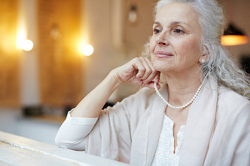 Pretty and elegant mature woman having rest