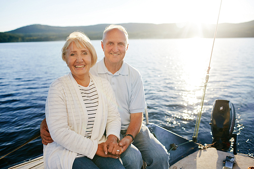 Romantic seniors spending vacation on yacht