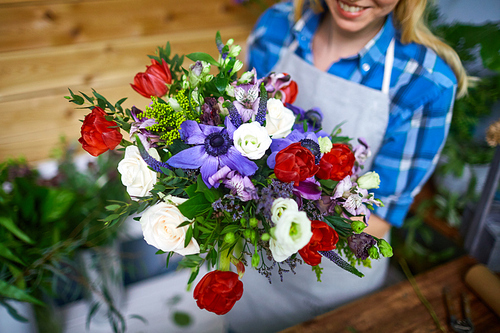 Fresh flowers being arranged into beautiful bouquet by florist