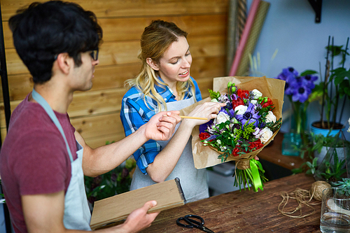 Sellers of flowers discussing new bouquet