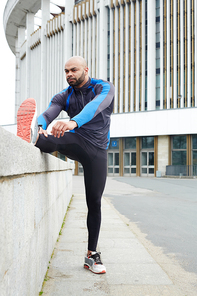 Healthy and active man making physical exercise outdoors