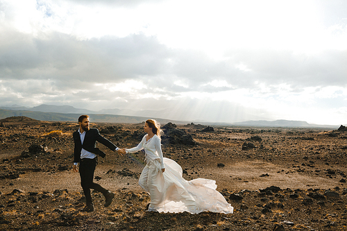 Attractive married couple enjoying honeymoon in Iceland