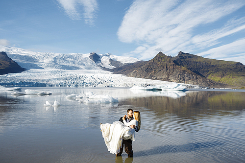 Amorous newlyweds enjoying their love adventure in Iceland