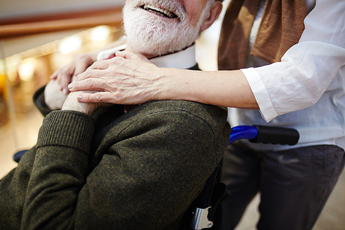 smiling aged man in . and his caregiver