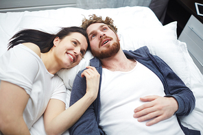 Young couple dreaming in bed