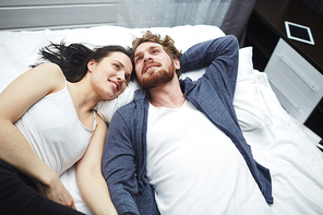 Cheerful man and woman enjoying home rest