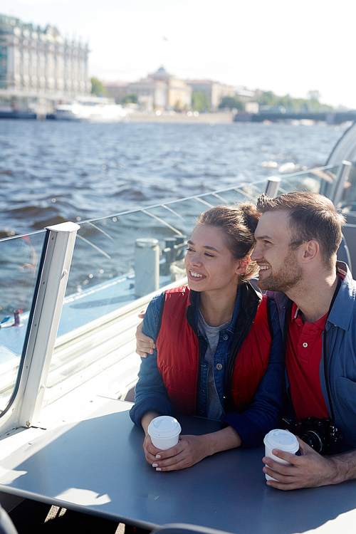 Young couple enjoying weekend on power boat