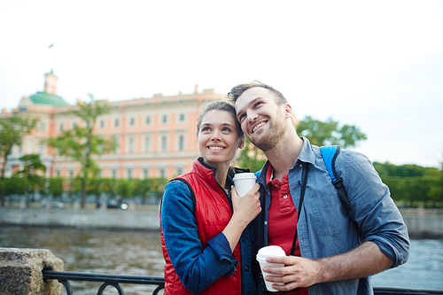 Affectionate travelers visiting place of interest during vacation