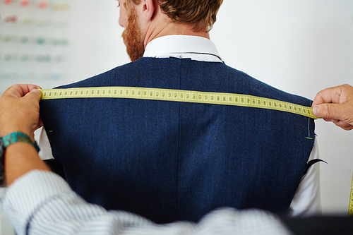 Measurring Back Clothier measuring back width of his client | 유토이미지 | 상세페이지 | 베이직샵 | 사진 ...