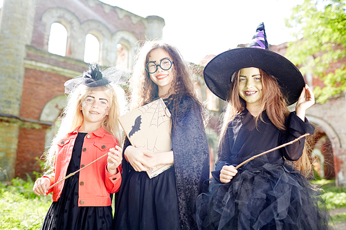 Happy halloween witches having party on sunny october day