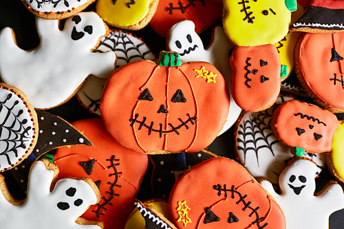 Background of halloween cookies in form of traditional symbols