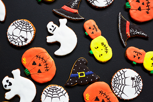 Halloween biscuits with colorful icings baked for the holiday