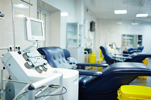 Donor platelets blood separation machine and empty armchair near by