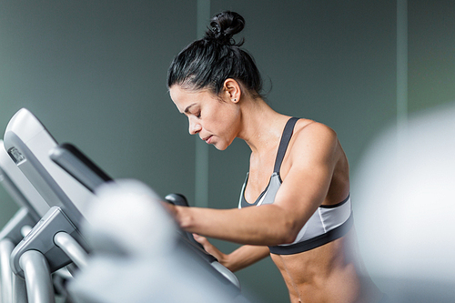 Exhausted woman training on treadmill