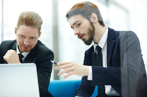 Confident economist making presentation to co-worker