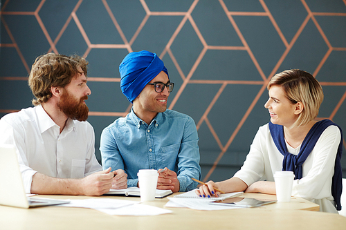 Group of intercultural co-workers having discussion