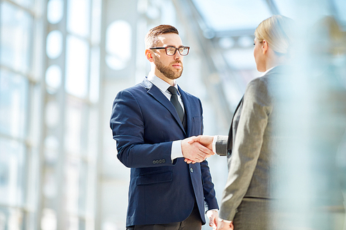 Two business partners greeting one another