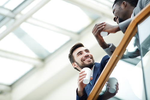 Friendly managers discussing after work plans at break