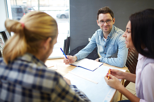 Group of creative students preparing for exams