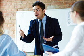 Business expert motivating colleagues not to ignore new working issues at meeting