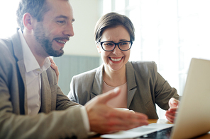 Confident man explaining his colleague online data