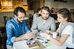 Designers discussing palette and looknig for information about new design trends in the net