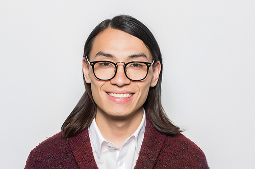 Happy Asian man in eyeglasses  with toothy smile